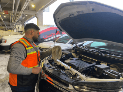 Unique Corp team member performing maintenance